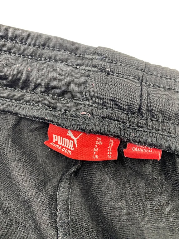 Puma Pantaloni della tuta neri con righe grigie unisex XS